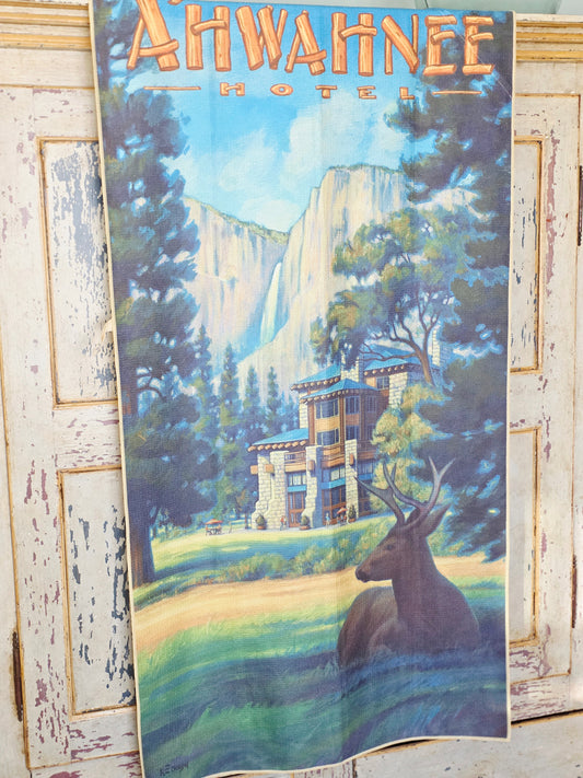 The Ahwahnee Hotel vintage travel poster beach towel hanging on an armoire