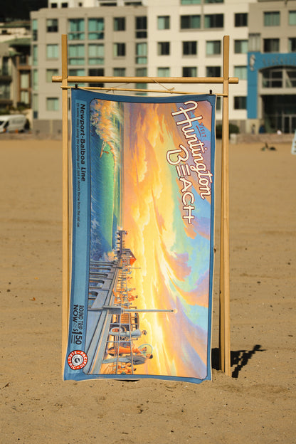 Huntington Beach vintage travel poster beach towel hanging up at beach
