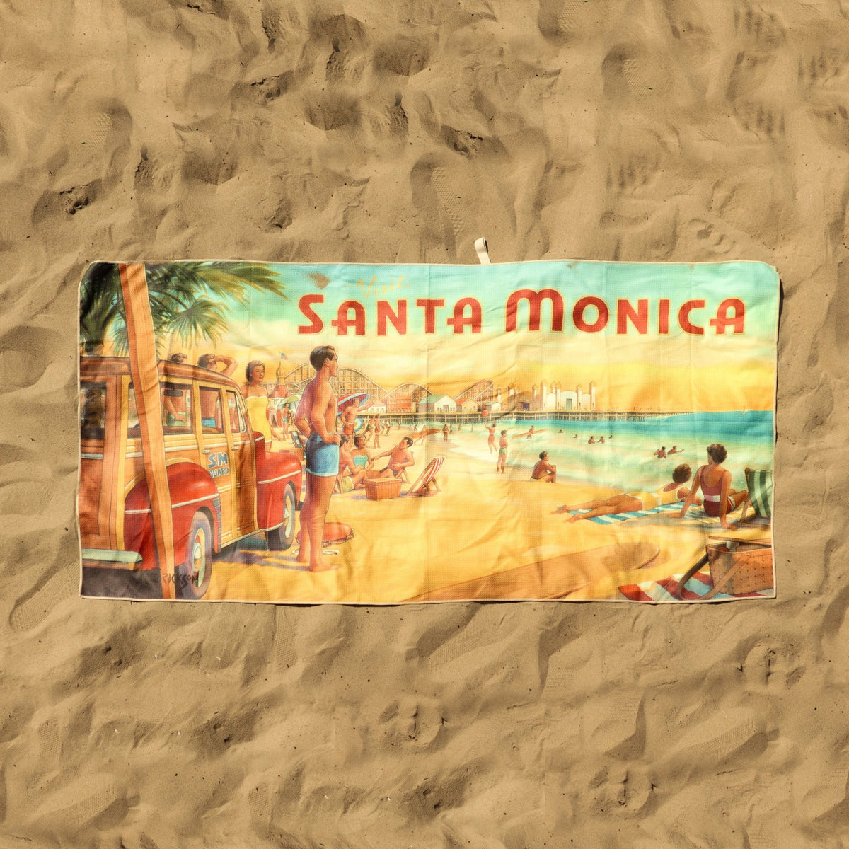 On sand: Santa Monica Pier vintage travel poster beach towel by Kerne Erickson